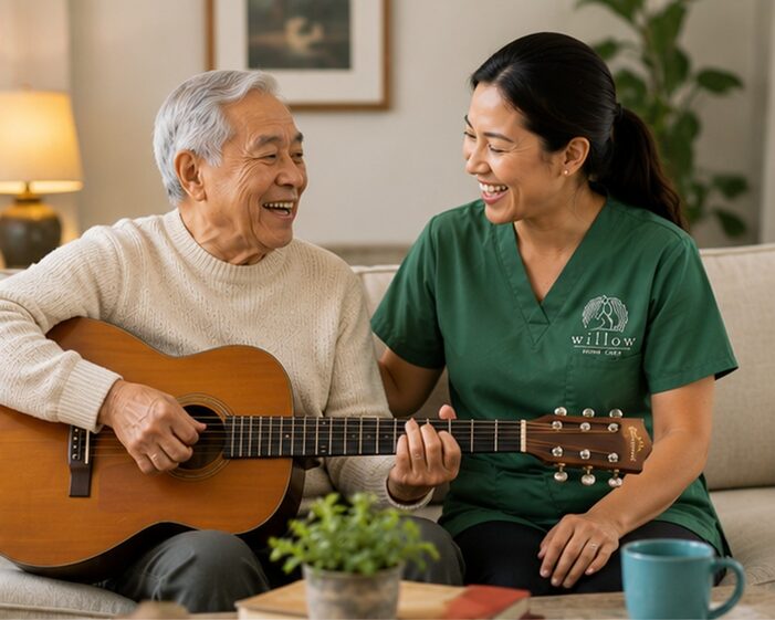 Caregiver and senior man playing guitar together
